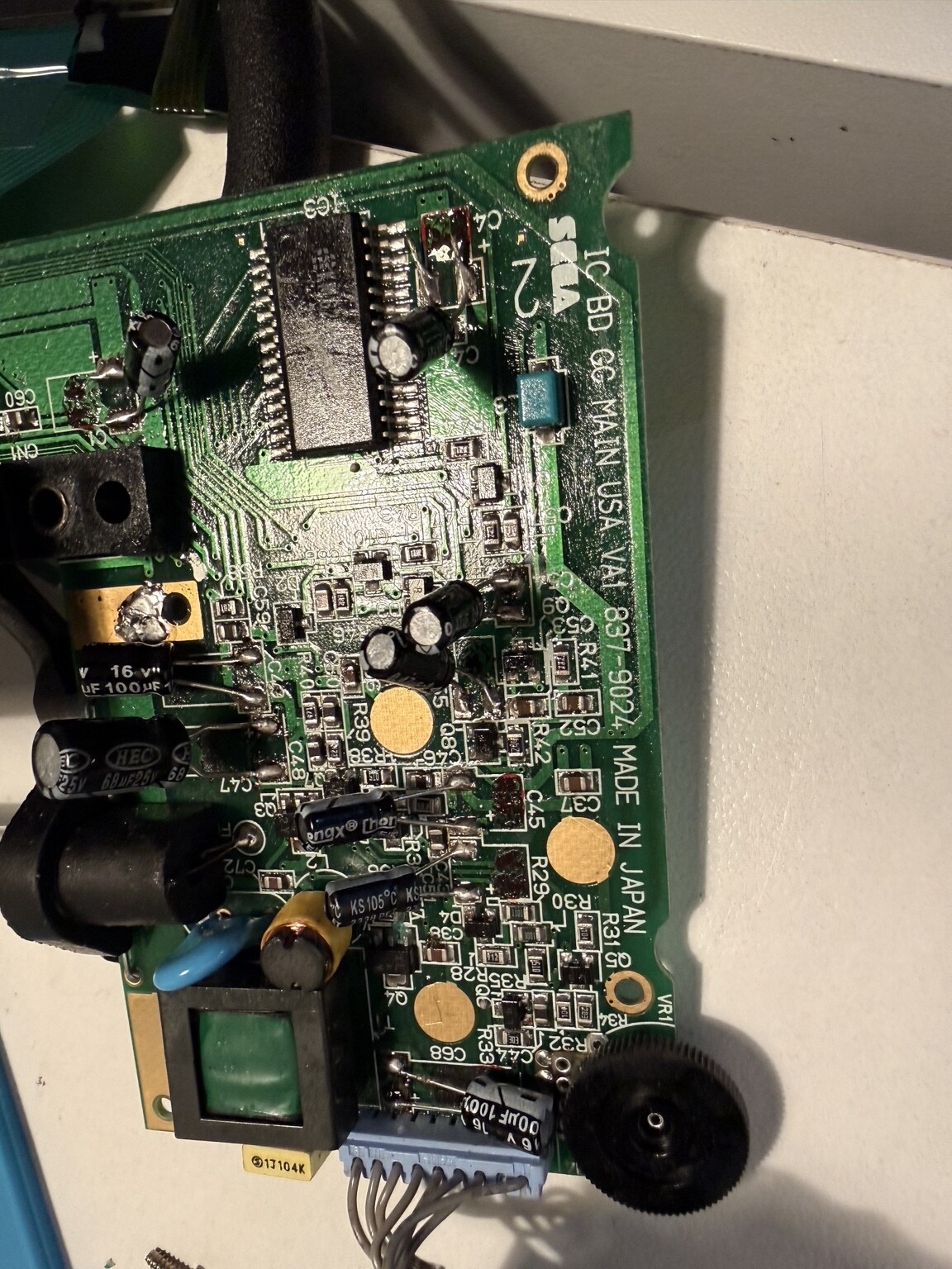 Close view of replacement capacitors installed on a Sega Game Gear VA1 circuit board